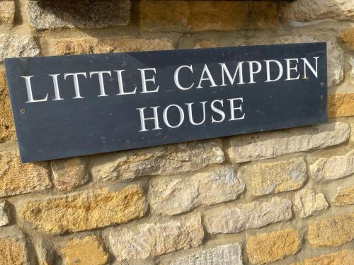 a sign for a little camden house on a brick wall at Little Campden House in Chipping Campden