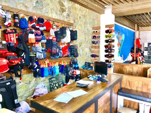 a room with a desk and many umbrellas on the wall at GVC New Gudauri Alpic Mountain view in Gudauri