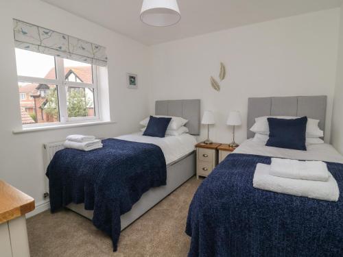 Postel nebo postele na pokoji v ubytování Holly Farm Cottage