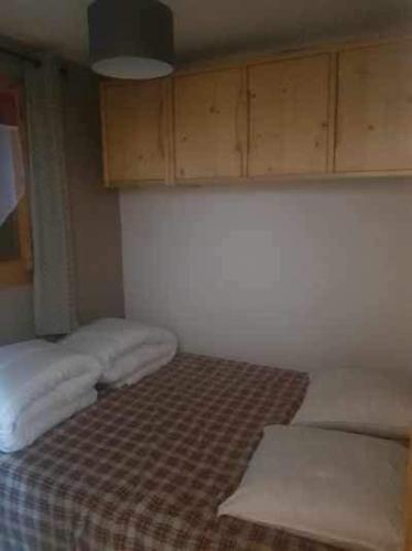 Postel nebo postele na pokoji v ubytování Appartement au cœur du domaine du grand massif