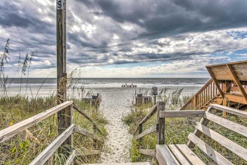 a stairway to the beach with the ocean in the background at Surfside Beach Escape with Pool - Walk to Ocean! in Myrtle Beach