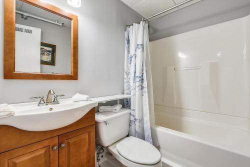 a bathroom with a sink and a toilet and a shower at Whiffletree C2 in Killington