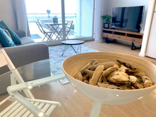 a bowl sitting on a table in a living room at L'Azor Suites - Océan in Ponta Delgada