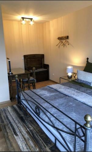 a bedroom with a large bed and a couch at Monteursunterkunft Talblick in Lügde