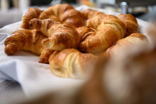 a bunch of croissants sitting on a table at Sonnenburg Hotel in Ehrwald