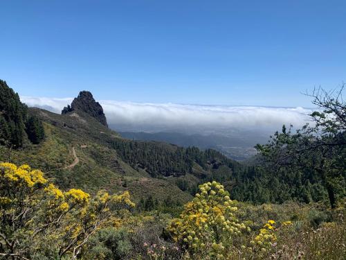 a view of a mountain with clouds in the distance at Villa Rosaura in Las Palmas de Gran Canaria