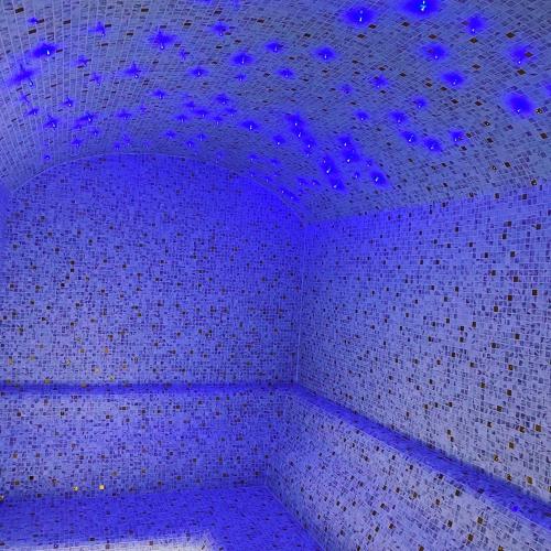 a room with purple lights on the ceiling at HOTEL ROYAL MOUNTAIN in Divčibare