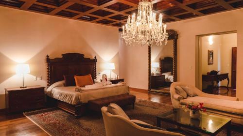 Кровать или кровати в номере Hotel & Hacienda La Caravedo
