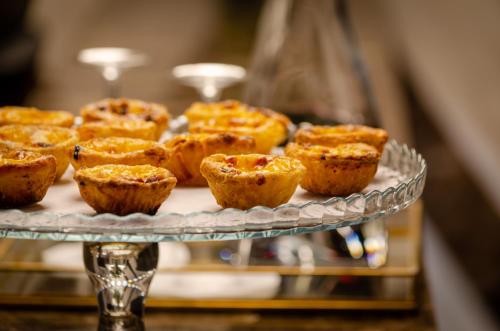 a bunch of muffins on a glass plate at Rossio Plaza Hotel in Lisbon