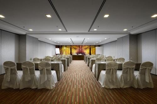 a room with rows of tables and chairs in it at Sunway Hotel Georgetown Penang in George Town