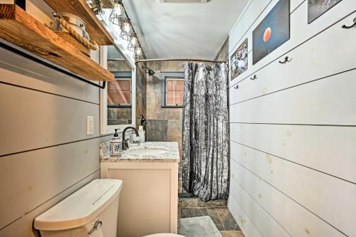 a bathroom with a toilet and a sink at Stratton Mountain Home with View - 2 Mi to Ski Lift! in Stratton
