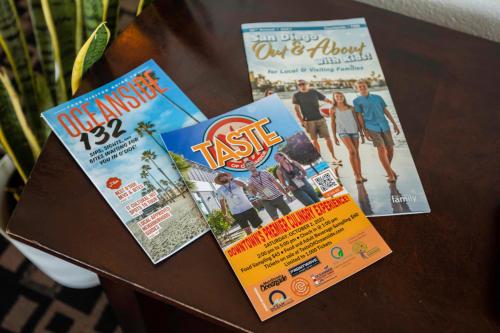 a table with two magazines on top of it at The Hotel Oceanside in Oceanside