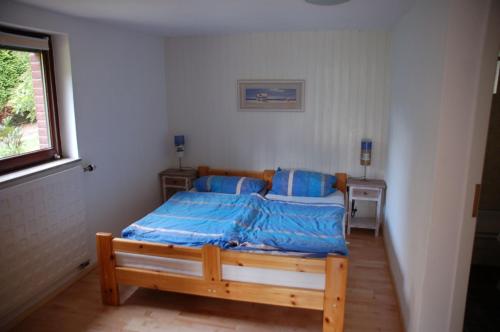 Postel nebo postele na pokoji v ubytování Haus Garten am Meer