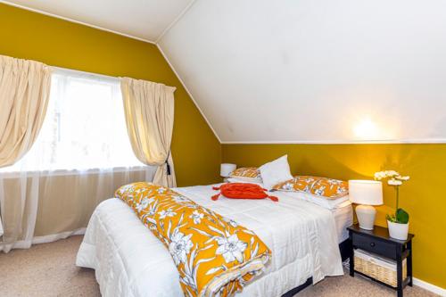 a bedroom with two beds and a window at The Magnolia Villa CBD in Timaru