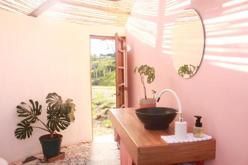 a bathroom with a sink and a mirror at Amatea de Villa de Leyva in Villa de Leyva