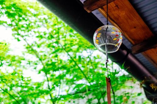a disco ball hanging from the ceiling of a house at Kotone Machiya-Inn 京町家旅宿 小都音 in Kyoto