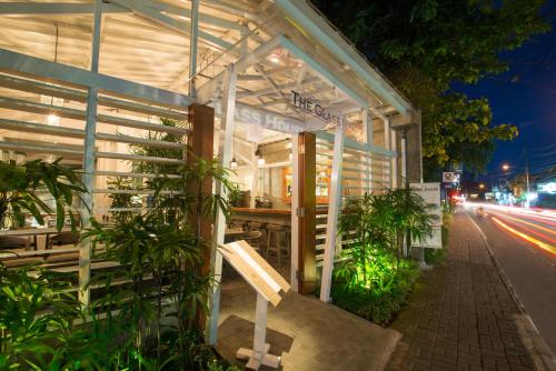 a building on the side of a street at night at Kejora Suites in Sanur