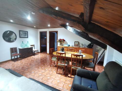 a dining room with a table and chairs at Casa pando 49 in Pando