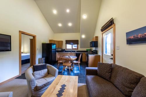 a living room with a couch and a table at Canyon Ridge Lodge in Golden
