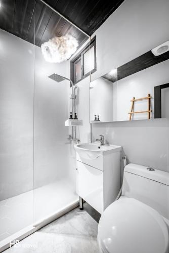 a bathroom with a toilet and a sink and a shower at Alishan Sunrise B&B in Fanlu