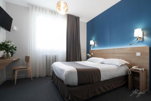Un ou plusieurs lits dans un hébergement de l'établissement le paris brest hotel