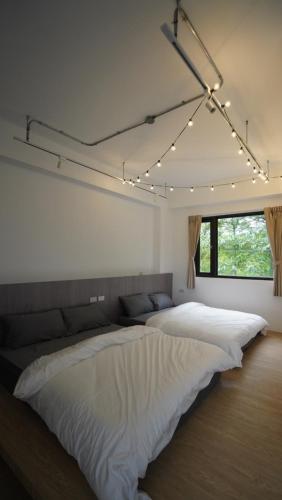 เตียงในห้องที่ Wendao Inn - HYGGE