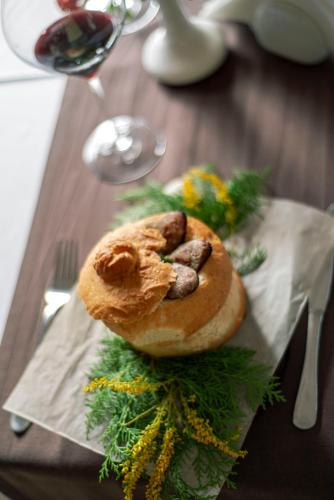 a bagel on a napkin on a table at Bogolvar Retreat Resort in Antonovka