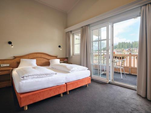 Postel nebo postele na pokoji v ubytování Hotel Garni Pinzgau, Bernd Hüttl