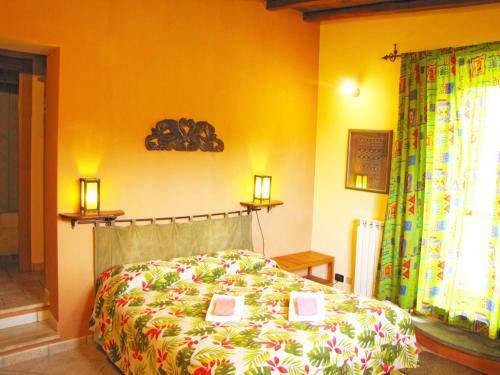 a bedroom with a bed with books on it at B&B Ai Glicini - Castelli Romani in Marino