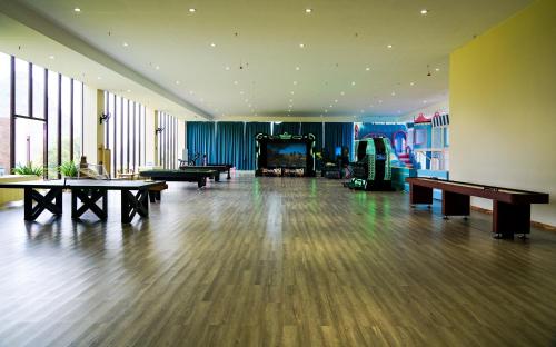 a large room with tables and ping pong tables at Misty Wonderland ,Yangshuo Xingping in Yangshuo