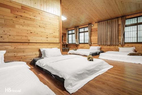 Postel nebo postele na pokoji v ubytování Alishan Sunrise B&B