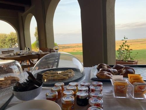 a table with pastries and other foods on a table at Il Poggio di Musignano in Musignano
