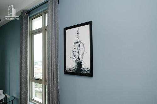 a picture of a head hanging on a wall at 10am-6pm, SAME DAY CHECK IN AND CHECK OUT, Work From Home, Shaftsbury-Cyberjaya, Comfy Home by Flexihome-MY in Cyberjaya