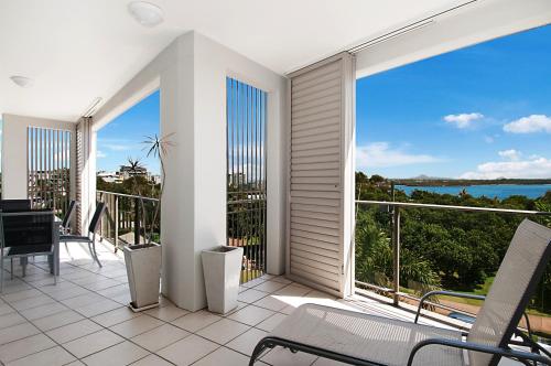 a balcony with a view of the ocean at Rovera Apartments in Maroochydore