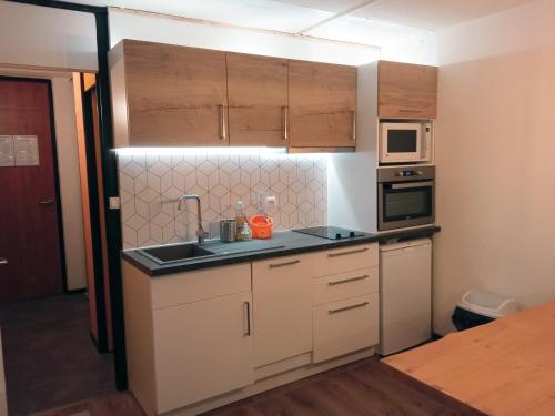 Η κουζίνα ή μικρή κουζίνα στο Superbe appartement vue panoramique pied des pistes