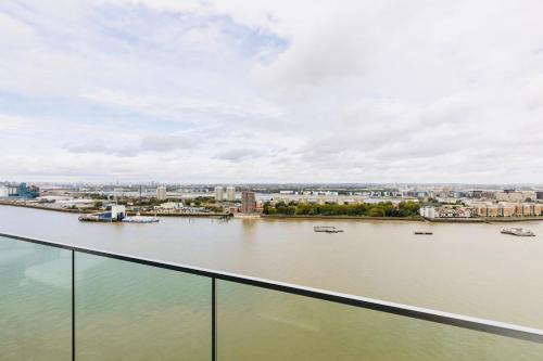 a view of a river with boats in the water at Executive Waterfront Split Penthouse in Woolwich