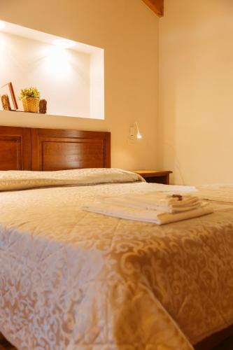 Una cama o camas en una habitación de Albergo Diffuso Polcenigo P.Lacchin