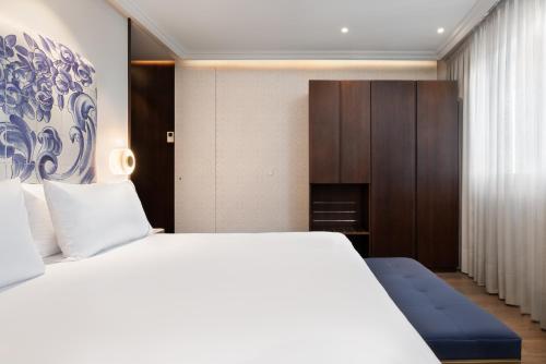 Кровать или кровати в номере Eurostars Universal Lisboa
