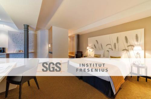a exhibit in a room with tables and chairs at nestor Hotel Stuttgart-Ludwigsburg in Ludwigsburg