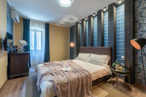 a bedroom with a large bed and a table at Villa Artiana in Rovinjsko Selo