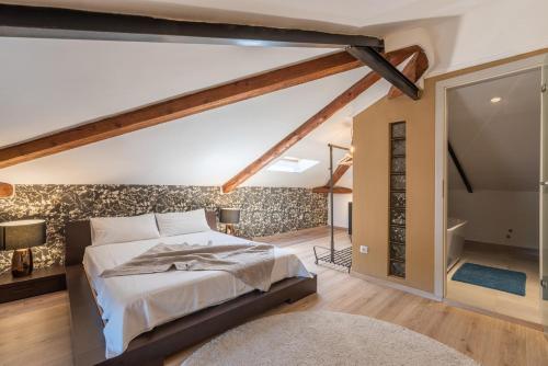 a bedroom with a large bed in a room at Villa Artiana in Rovinjsko Selo