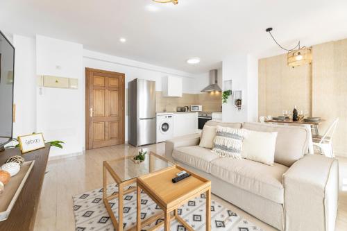 a living room with a couch and a table at Apartments Urban Arrecife in Arrecife