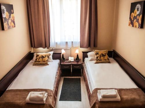 Posteľ alebo postele v izbe v ubytovaní Hotel Feniks
