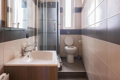 a bathroom with a sink and a toilet at Parea House 1 in Milan