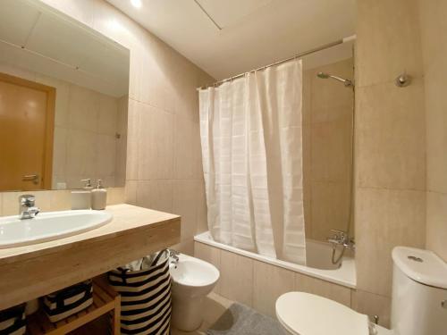 a bathroom with a sink and a toilet and a shower at Terracotta terrace in Barcelona