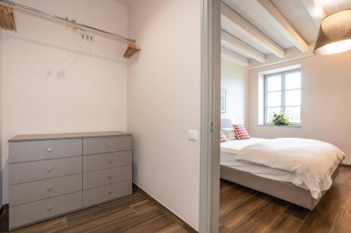 a bedroom with a bed and a window at Borgo di Drugolo in Lonato del Garda