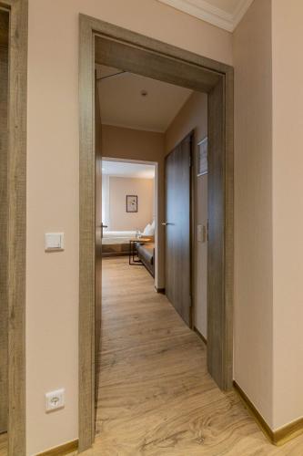 a hallway with a door leading to a room at Hof Ehrenfels in Mainz