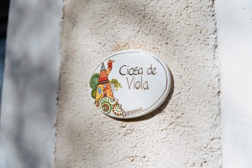 Un certificado, premio, letrero u otro documento en Albergo Diffuso Polcenigo Ciasa VeS