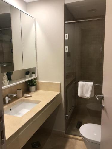 a bathroom with a sink and a shower at Jutta Deluxe 2-Bedroom-Apartment Mangroovy-M7 El Gouna in Hurghada