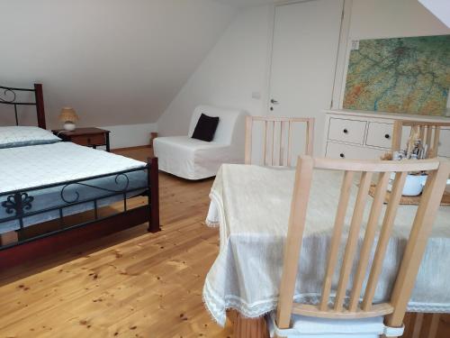 A bed or beds in a room at Forest Romantic Apartment Brdy